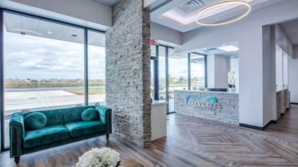 A reception area with a green couch and a stone wall

AI-generated content may be incorrect.