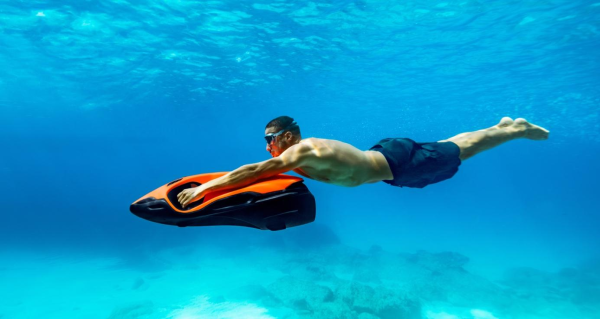 A person swimming underwater with a float

AI-generated content may be incorrect.