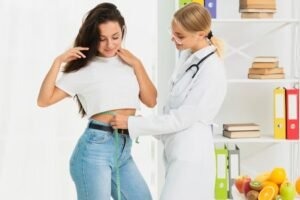 imgi 26 medium shot nutritionist measuring patient 23 2148302085