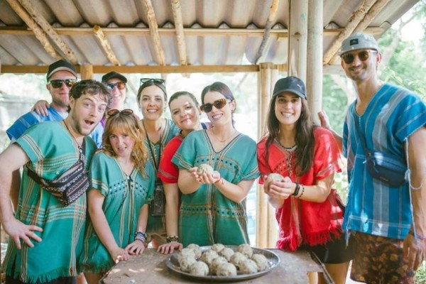 A group of people standing around a table

AI-generated content may be incorrect.