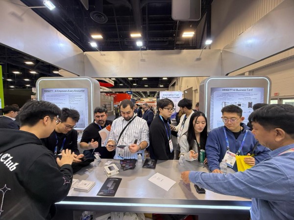 Visitors gather at MMEETT’s booth during CES 2026 in Las Vegas, where the company demonstrated its AI Business Card in live, real-world use.