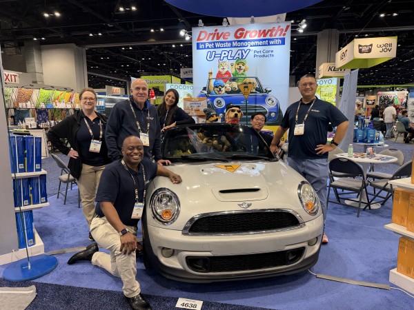 A HoneyCare team promotes U-PLAY pet care products and highlights innovation in pet waste management.