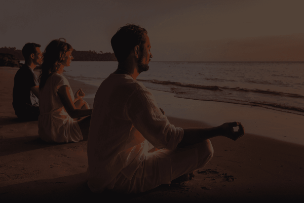 People sitting together for an in-person group meditation session